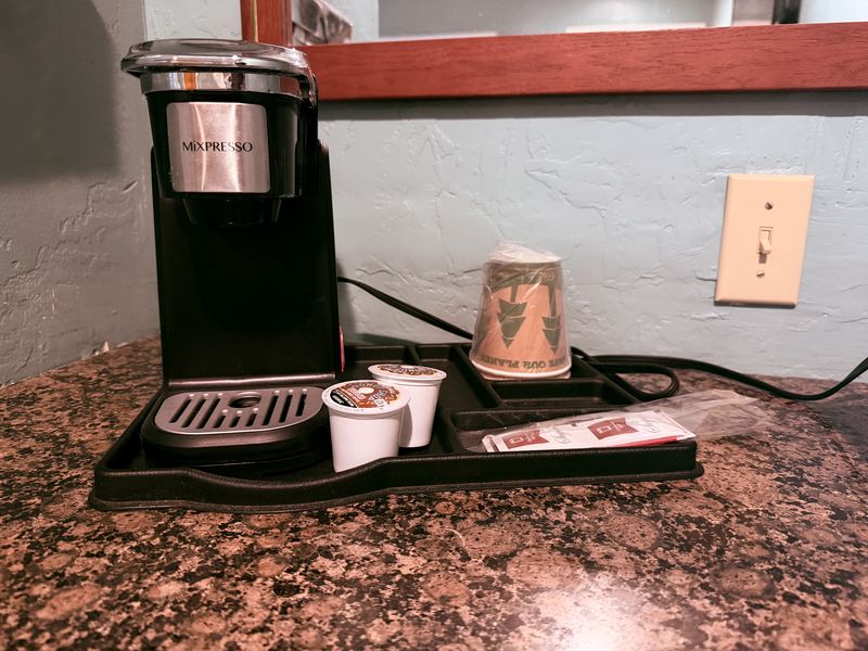 In-room coffee maker set up and ready on the counter